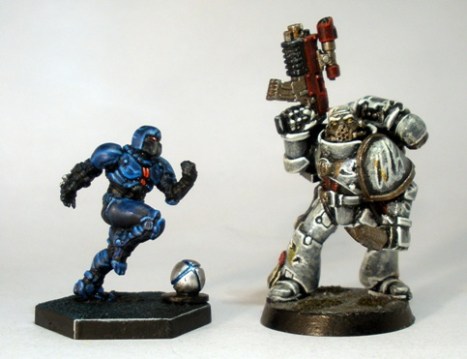 L to R: Dreadball Corporation (human) Striker, 40K Space Marine.