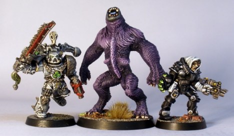L to R: GW Chaos Space Marine, SotTR Urzine Were Bear, GW Inquisitor