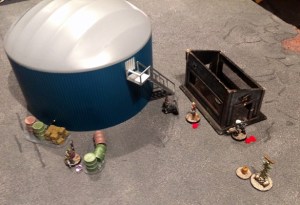 Verhoeven returns to the firefight, suspecting that Rosa may have found what they are looking for.  Rosa takes out the approaching melta-weapon equipped UM trooper only to be shot and wounded by the UM engineer.  The engineer then activates some arcane technology and fades from existence...