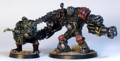 L to R: GW ork (with a Kromlech head), Deadzone Mauler Class Ripper Suit.