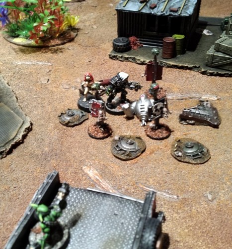 Grot blasta fire ricochets around the Inquisitor and pole dancer occupied minefield. The Inquisitor is unruffled, engrossed in the task at hand. The entertainment industry employee, not so much.