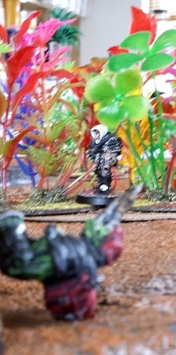 Taking a cue from Rosa, the Inquisitor decloaks to the flank of the main ork force and drops Kronkie with a controlled burst from his custom Tau tech combi-rifle.