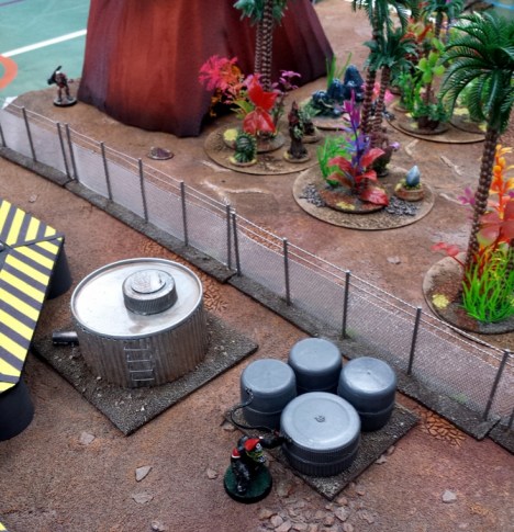 Da Black Major titters evilly as he hides near in the compound, waiting to ambush any keyholders as they arrive at the shuttle. In the background Milo the Space Eunuch prepares to investigate a corpse.