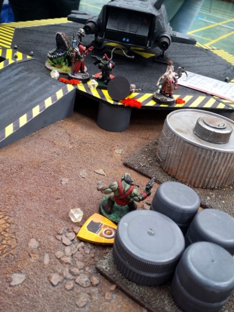 Channelling the star power of a green Sean Connery, Zardork continues his unstoppable approach, closoing on the choas at the landing pad.  Magos Kurgan drops his key.  Ever the opportunist, Da Major dodges out of combat and grabs it from under the lashing vines and gnashing maw of the Venusian Man-Trap.  Verhoeven falls off the fence for a second time.  Everybody except Verhoeven laughs.