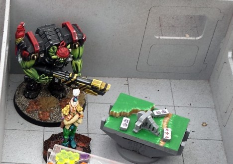 Crackers the astro-parrot leads Big BIlly to the Eldar racketeer.  "Roaawk! Where be th'booty, y'pasty faced lubber!" says Crackers.  "BIG BILLY!" says Big BIlly.  "Security!  Security!!!  Not the face, NOT THE FACE!  AAAArgh!" says the Racketeer