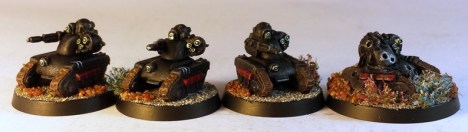 Three tracked drones and the wrecked version.