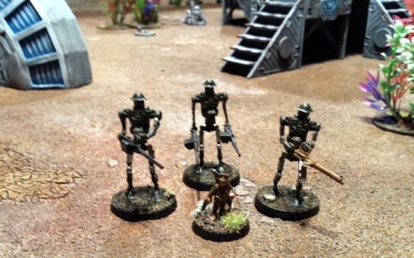 The ever more unhinged Captain Jameson of the Ratling forces of Leprecia IX, accompanied by his mechanical colleagues.