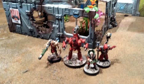 Magos Kurgan, Heirarch (and electropop enthusiast) Mijur and Brother Char of the corrupted Adeptus Mechanicus of the Kabeiroi accompany a Castellan battle automata to the partially ruined outpost.