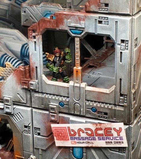 Judge Shaw takes up position in the ruins of Sector 13, lying in wait for the arrival of the East Meg Rad-Sweepers.