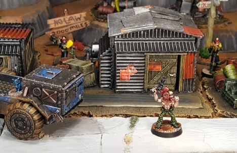 The law tracks Red down to a Cursed Earth shanty...