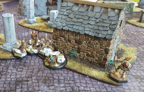 The dwarfs attention is momentarily grabbed by the beautiful Hirst Arts buildings.